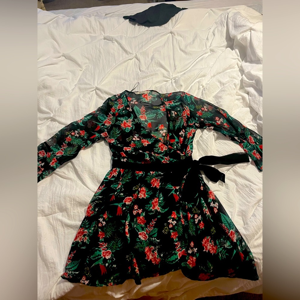 Black, green and white wrap romper with rosé embellishments throughout. Zara